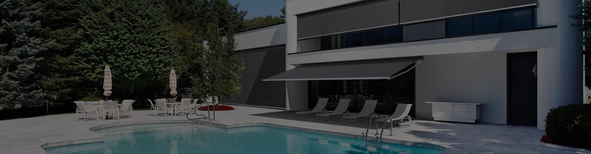 Cover image of modern home with swimming pool featuring patio installed with Folding Arm Awnings by Luxaflex. Available at Complete Blinds Sydney.