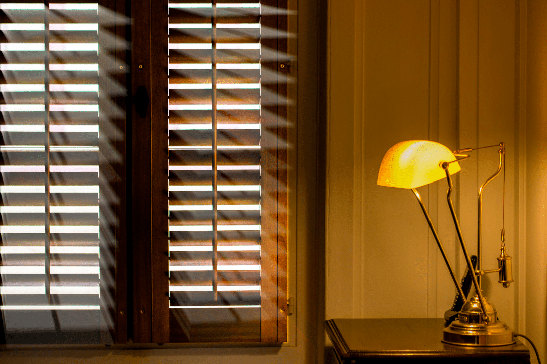 Room installed with plantation shutters- offering privacy and light control.