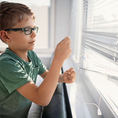 Child Pulling On Window Curtain/blind Cord.