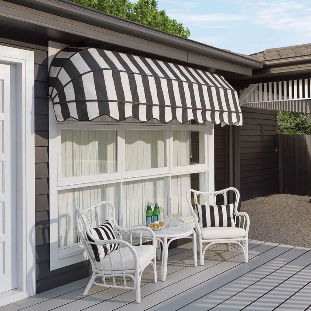 Canopy, stationary style awnings. Vintage black and white pinstripe design, installed at home patio.