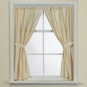 a window with a curtain hanging from it