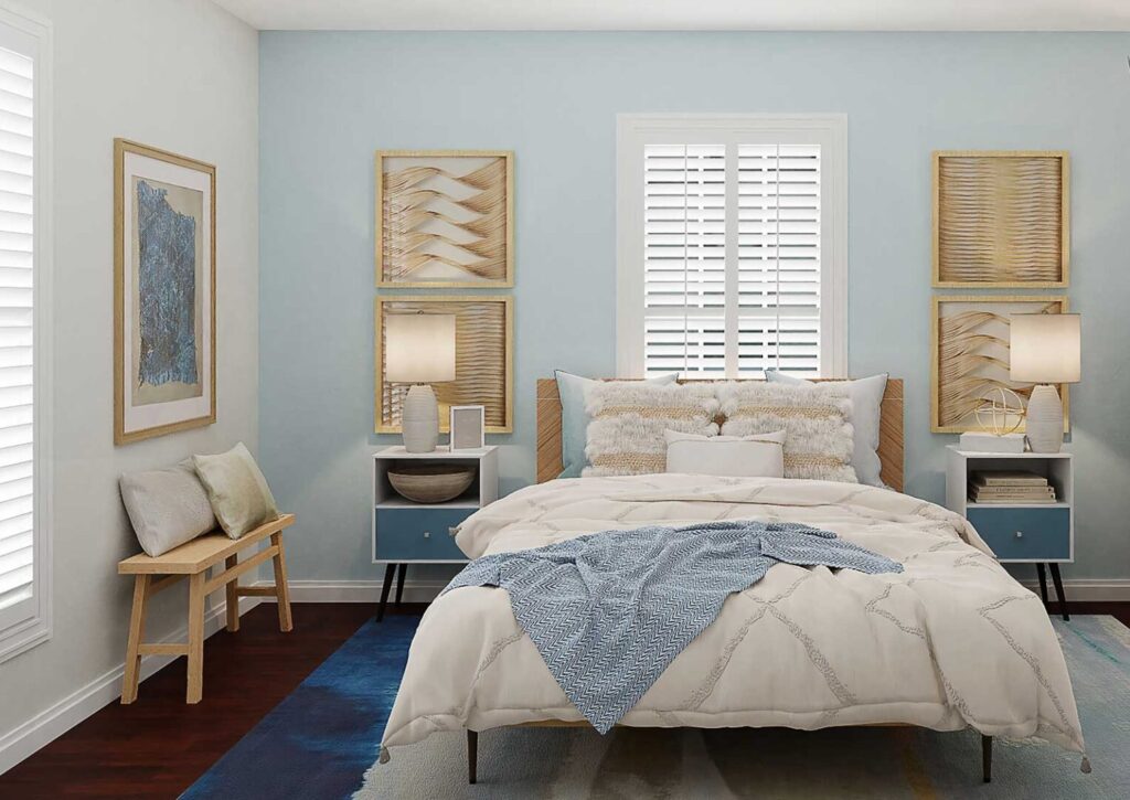 Cozy baby blue themed bedroom installed with white plantation shutters on double-hung windows.