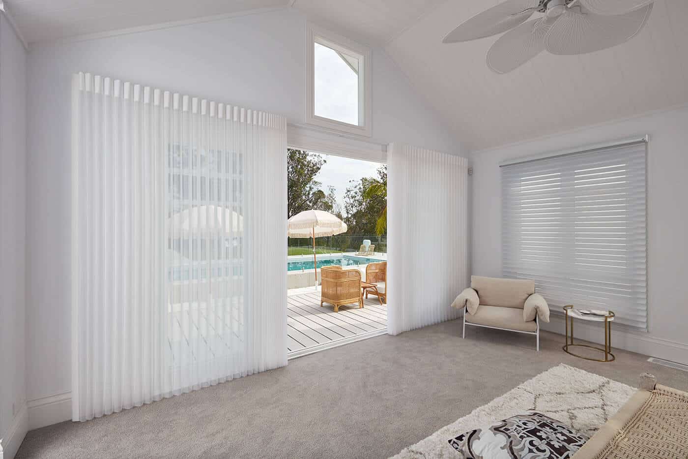 Lightweight Luminette Privacy Sheers by Luxaflex, window furnishing for diffusing natural light indoors. Elegant design in modern living room. On display in Complete Blinds showroom.