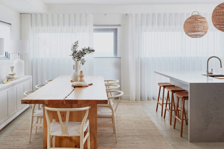 Modern Transitional Wooden Kitchen And Dining Room Complete With Stone And Wood Furnishings, Featuring Luxaflex Sheer Curtains Covering Windows And Diffusing Natural Light. Made By Luxaflex, Available In Our Sydney Showroom.