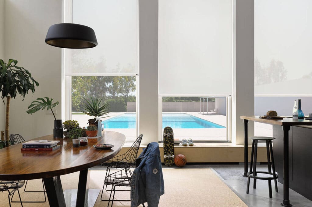 Aesthetic and functional Luxaflex Roller Blinds in contemporary dinning space. Available in Blockout, Sunscreen and Translucent fabrics.