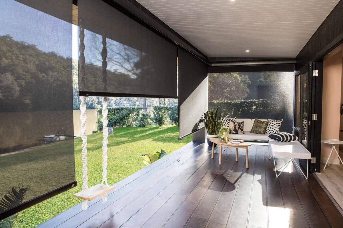 Modern Luxurious And Elegant Brown-themed Patio With Access To Home Garden Installed With Evo Awnings By Norman. Available At Complete Blinds Sydney. Straight-Drop Awnings For Modern Homes.
