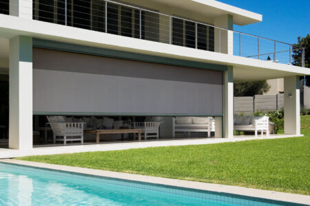 Modern Contemporary Home With Patio, Garden, And Swimming Pool, Featuring Luxaflex Evo Magnatrack Awnings Blocking Out Sunlight And Providing Shades To The Patio. For Sale In Our Sydney Showroom.