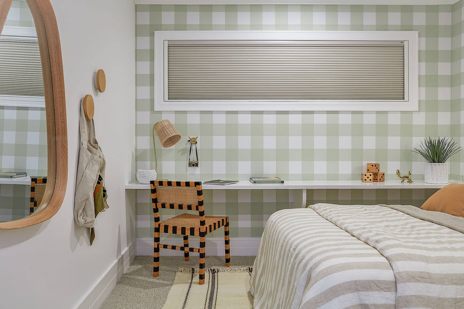 Eclectic style bedroom with green checkered walls featuring Luxaflex Duette Shades completely blocking out sunlight from entering. Made in Australia.