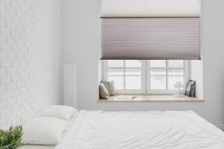 Eco-friendly Norman Portrait Honeycomb Shades In Cozy White Room Blocking Out Light While Providing Superior Heat Insulation In The Room. Made In Australia.