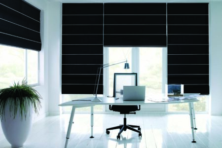 Modern, Elegant And Clean Home Office Space With Large Window Panes Covered By Luxaflex Roman Blinds, Blocking Out Sunlight And Offering Privacy Control. Made In Australia.