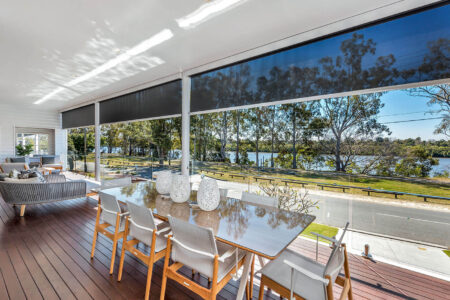 Modern Luxurious And Elegant Home Dining Area With Garden View Installed With Evo Awnings By Norman. Available At Complete Blinds Sydney.