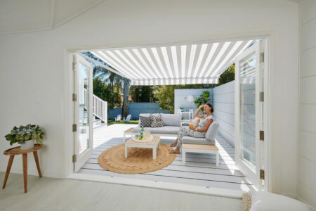 Nordic Styled Home Patio Featuring Folding Arm Awning By Luxaflex.