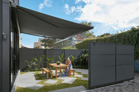 Modern Home Garden With Patio Installed With Luxaflex Folding Arm Awning. Available At Complete Blinds Sydney.