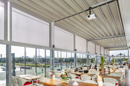 Rooftop Commercial Dining Space Installed With Palmiye Fabric Retractable Awnings By Luxaflex.