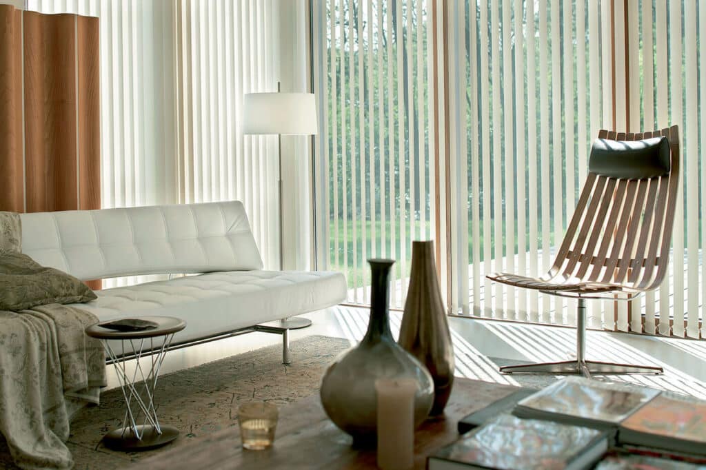 Modern contemporary living room featuring vertical blinds installed by Complete Blinds.