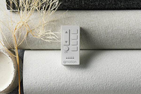 Close Up Aesthetic Shot Of Controller For Motorised Roller Blinds And Fabric Of The Blinds. Automated Blinds And Shutters.